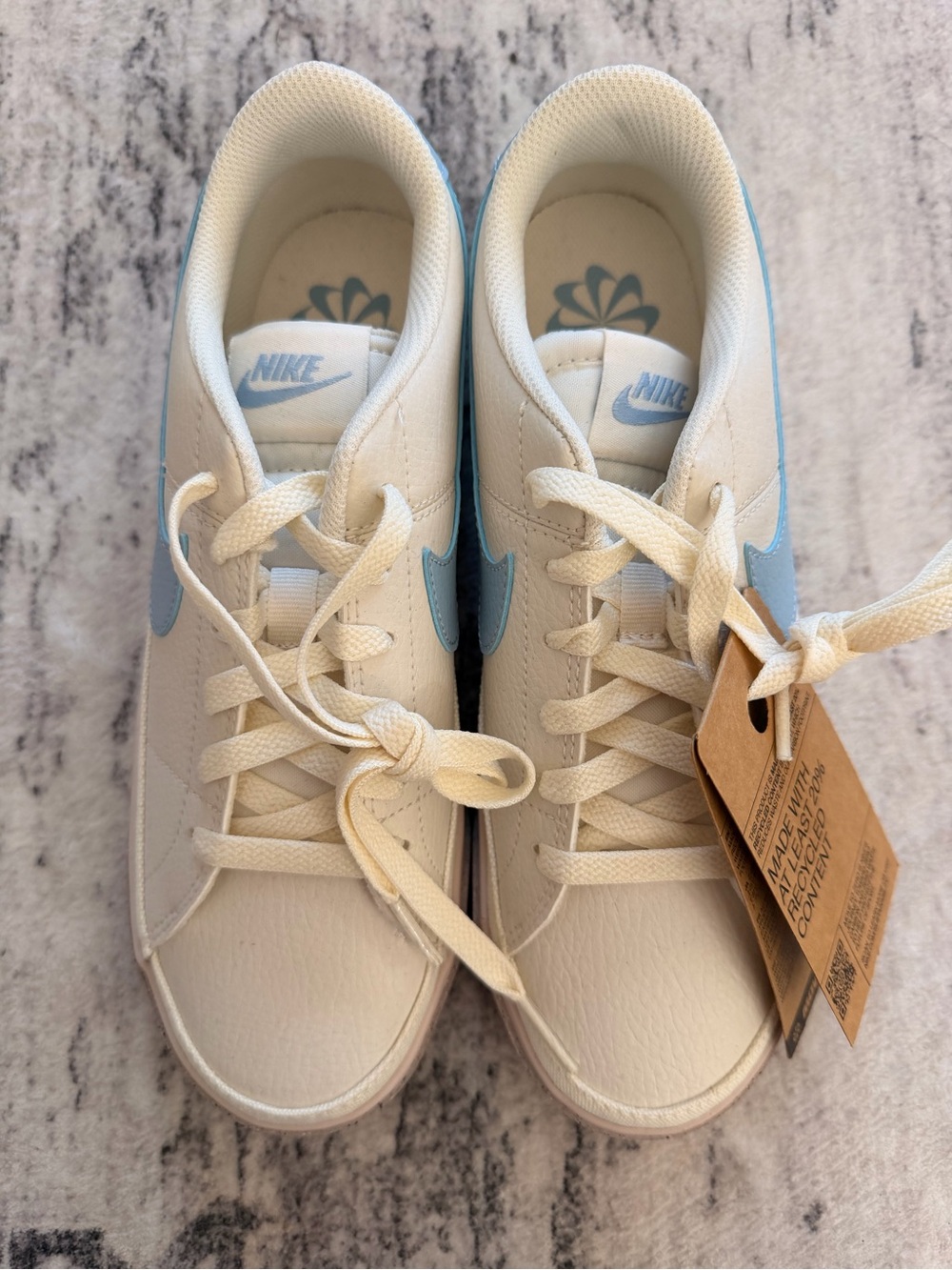 Women’s Nike Cream Sneakers with Light Blue Swoosh